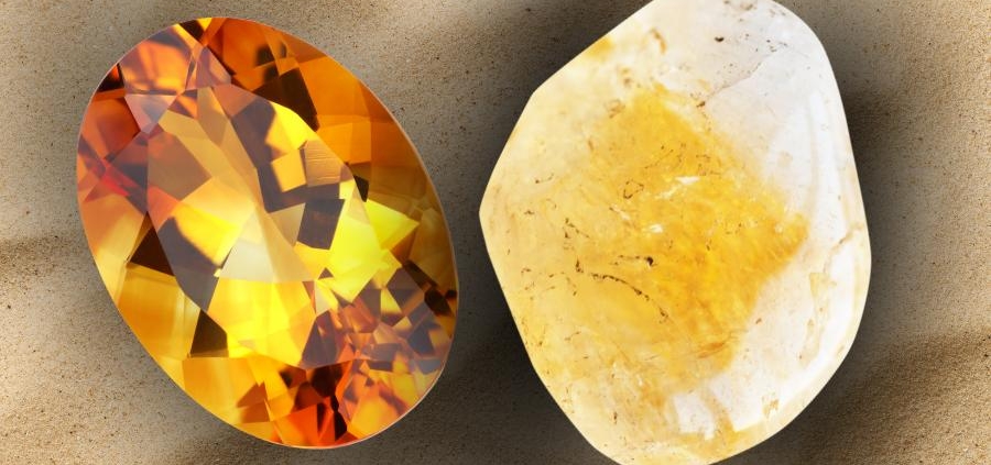 Topaz and Citrine stone lay on a beach