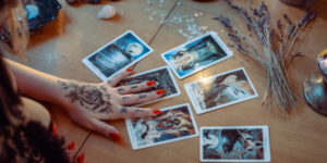 A Lady's hand touching some tarot cards