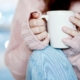 Lady holding a cup of coffee