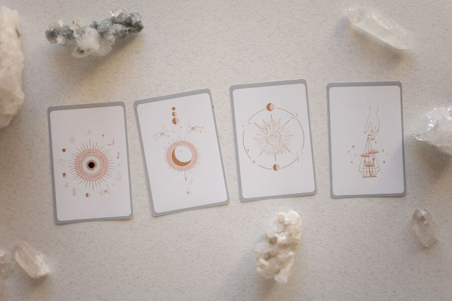 pastel pink coloured table with angel and oracle cards laid out