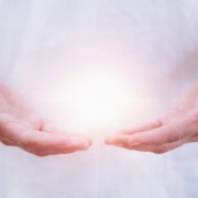 a healing psychic reader holding an aura in his hands