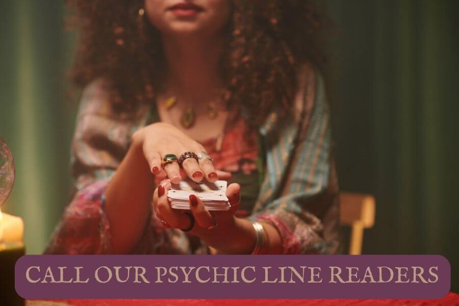 A psychic line reader holding tarot cards banner