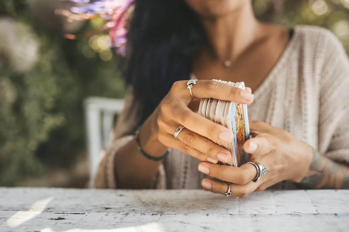 Woman shuffling Tarot Readings